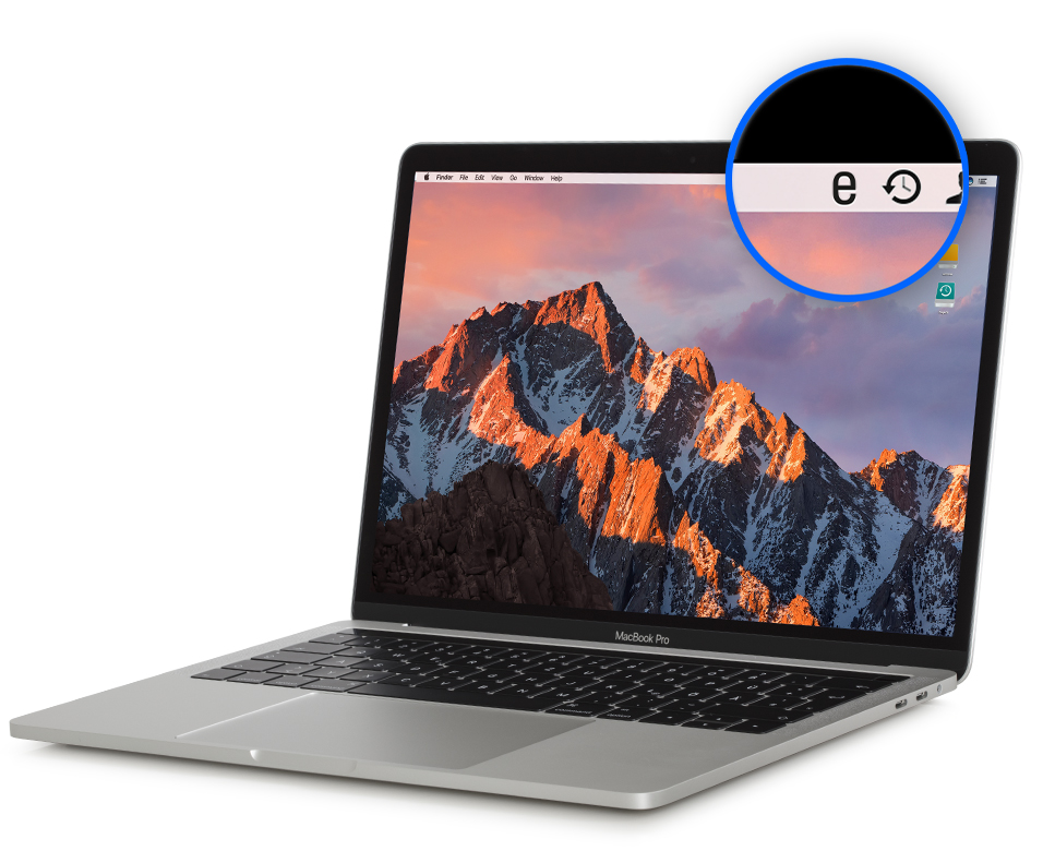 Laptop displaying a mountain landscape wallpaper.