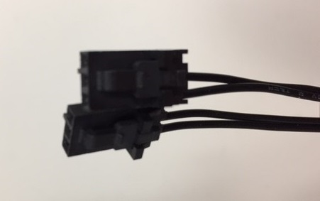 Black electrical connectors with wires.